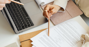 Topel Forman tax services featuring a laptop and documents