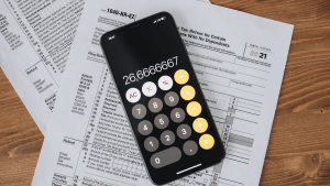 Calculator on top of tax forms representing individual tax planning